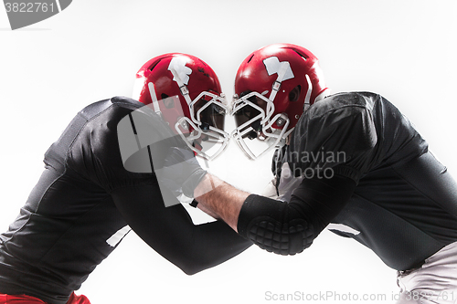 Image of The two american football players fighting on white background