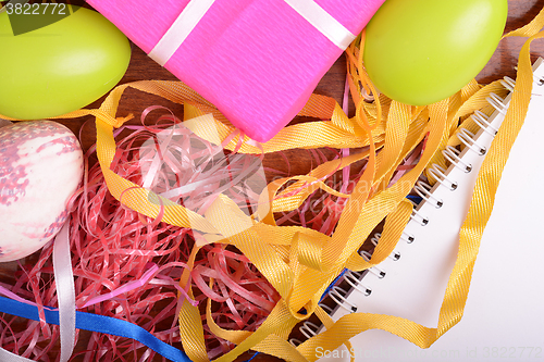 Image of Easter background with eggs, ribbons and spring decoration