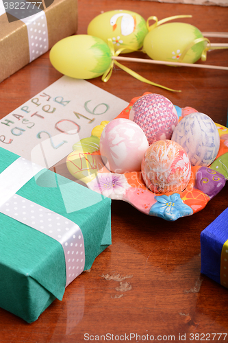 Image of holiday gift box with painted easter eggs