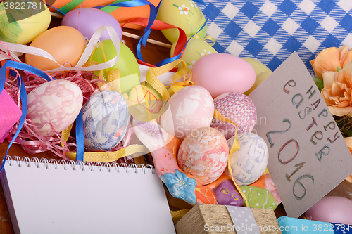 Image of Easter background with eggs, ribbons and spring decoration