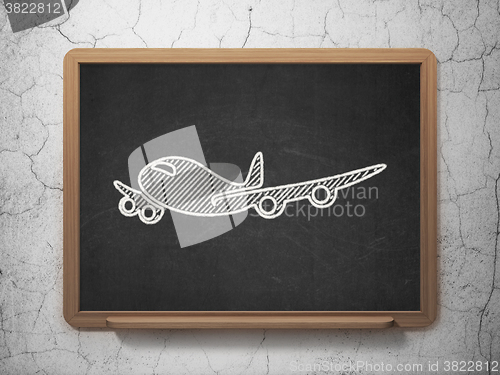 Image of Tourism concept: Airplane on chalkboard background
