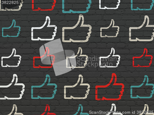 Image of Social network concept: Thumb Up icons on wall background