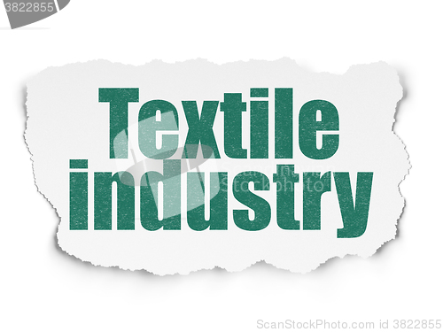 Image of Manufacuring concept: Textile Industry on Torn Paper background
