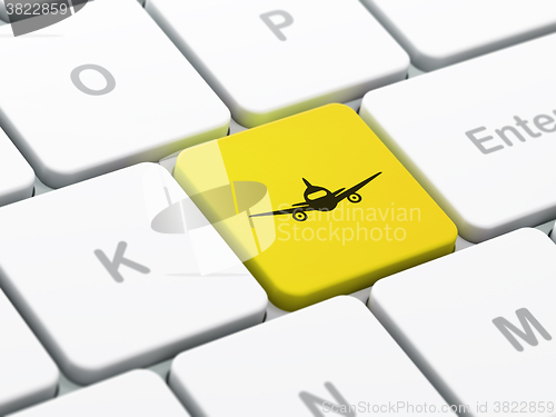 Image of Tourism concept: Aircraft on computer keyboard background