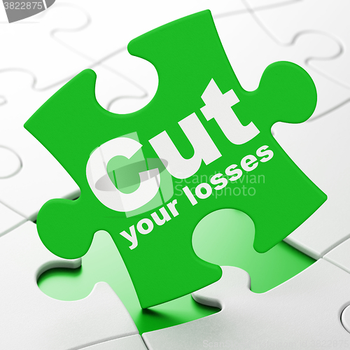 Image of Finance concept: Cut Your losses on puzzle background