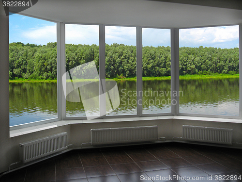 Image of modern window of veranda overlooking the river 