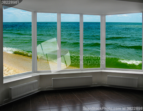 Image of plastic window with view of marine waves