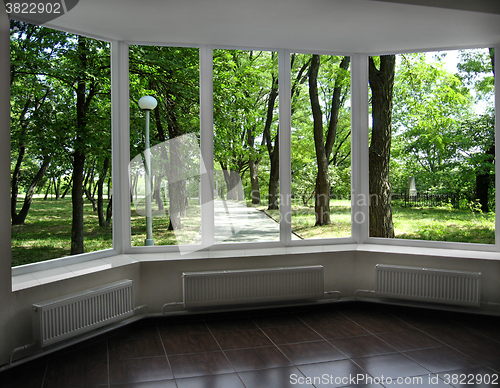 Image of plastic window with view of city park