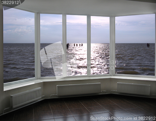 Image of plastic window with view of evening lake Sivash