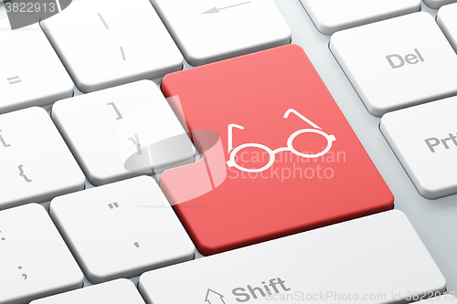 Image of Learning concept: Glasses on computer keyboard background