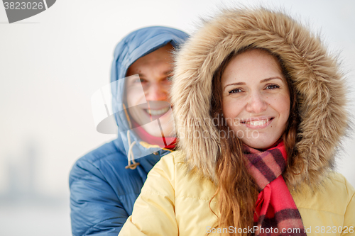 Image of Couple smiling, hugging 