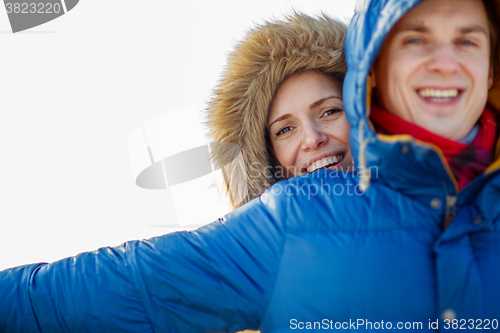 Image of beautiful couple embracing in winter