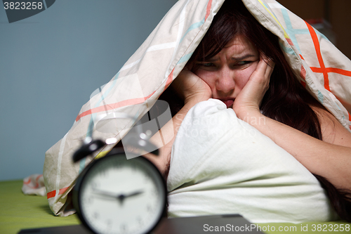 Image of Woman with blanket under her head