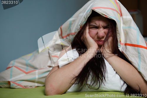 Image of Woman with blanket under her head