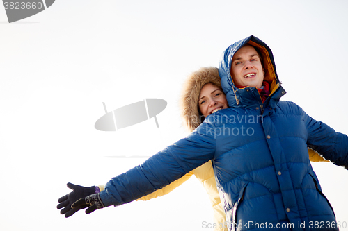 Image of beautiful couple embracing in winter