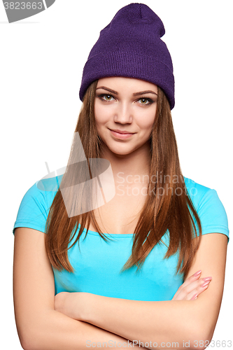 Image of Smiling teen girl standing in hat