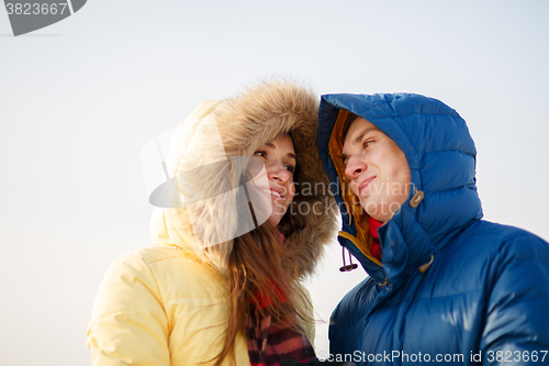 Image of beautiful couple embracing in winter