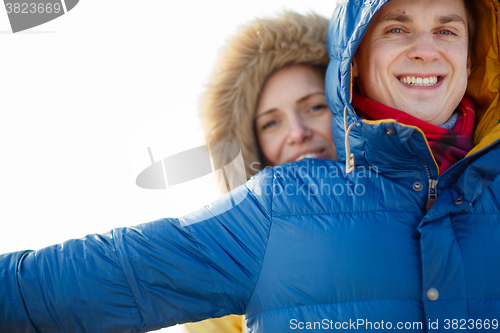 Image of beautiful couple embracing in winter