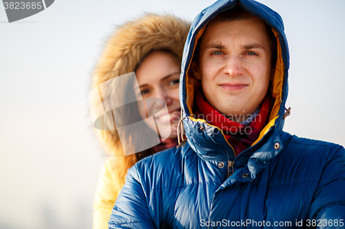 Image of Young couple together at outdoor in winter