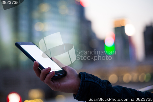 Image of Woman using her mobile phone