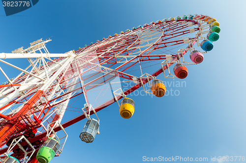 Image of Ferris wheel under blue sky