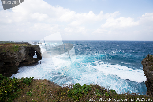 Image of Manza cliff in Okinawa japan under storm 