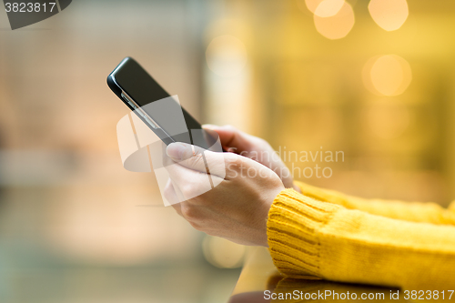 Image of Woman use of mobile phone