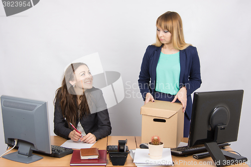 Image of Office employee satisfied dismissal colleagues