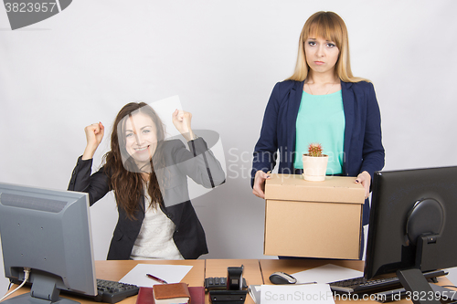 Image of Office worker rejoices that fired colleague