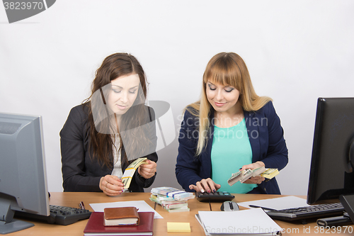 Image of For office table girl enthusiastically believe the money