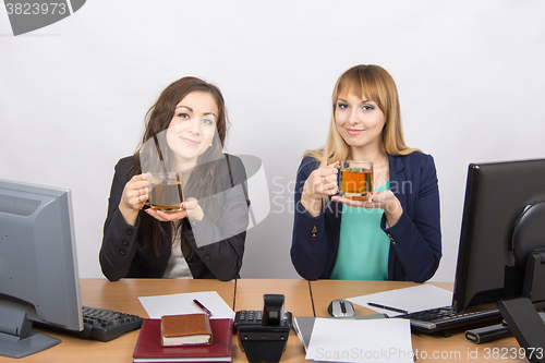 Image of Tea Break two office employees at the desk