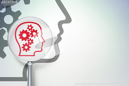 Image of Education concept:  Head With Gears with optical glass on digital background