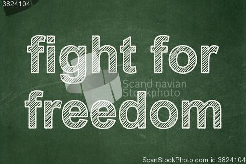 Image of Political concept: Fight For Freedom on chalkboard background