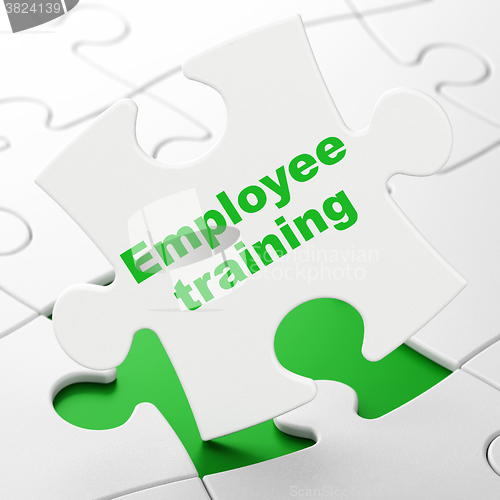 Image of Studying concept: Employee Training on puzzle background