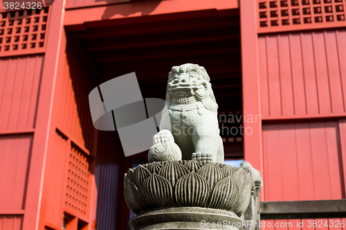 Image of Stone guardian lion dog with Japanese