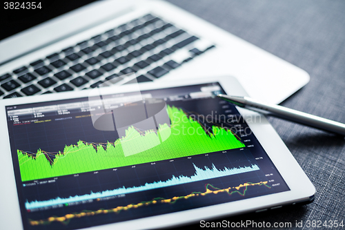 Image of Stock market data analyzing on tablet pc
