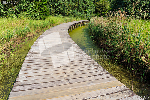 Image of Wooden bridge across the lake 