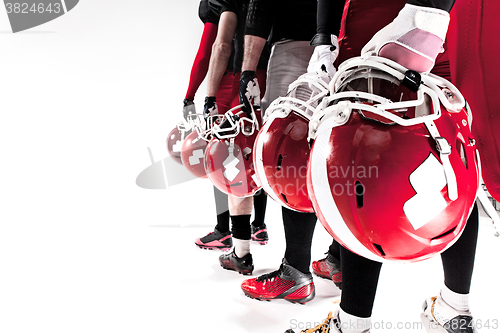 Image of The hands of american football players with helmets on white background