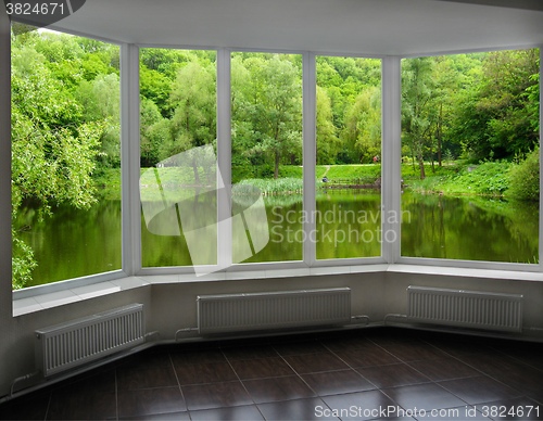 Image of modern window of veranda overlooking the river 