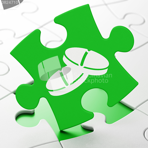 Image of Healthcare concept: Pills on puzzle background