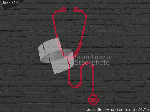 Image of Health concept: Stethoscope on wall background