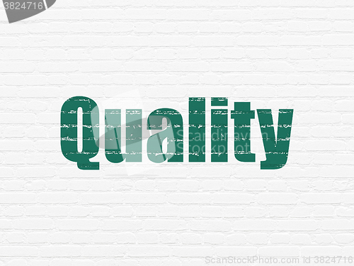 Image of Marketing concept: Quality on wall background