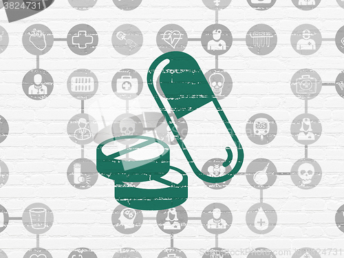 Image of Health concept: Pills on wall background
