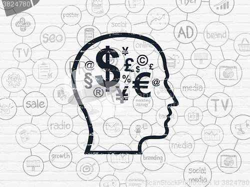 Image of Advertising concept: Head With Finance Symbol on wall background
