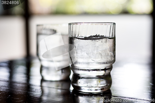Image of Glass of water on table in restaurant
