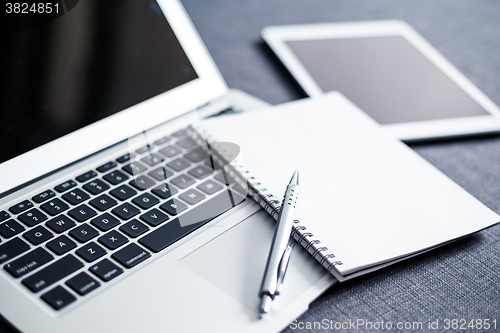 Image of Laptop, tablet and note book