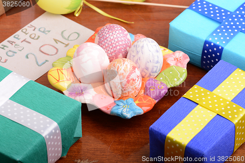Image of holiday gift box with painted easter eggs