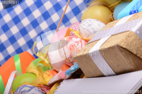 Image of Easter background with eggs, ribbons and spring decoration