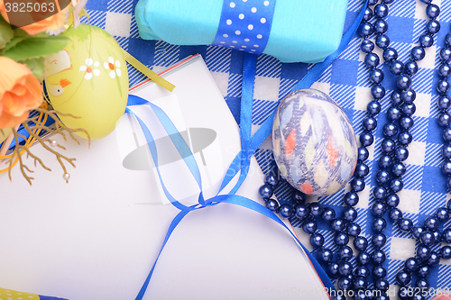 Image of Assorted Easter coloured eggs in the paper egg box