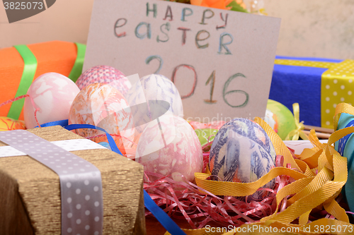 Image of Easter background with eggs, ribbons and spring decoration